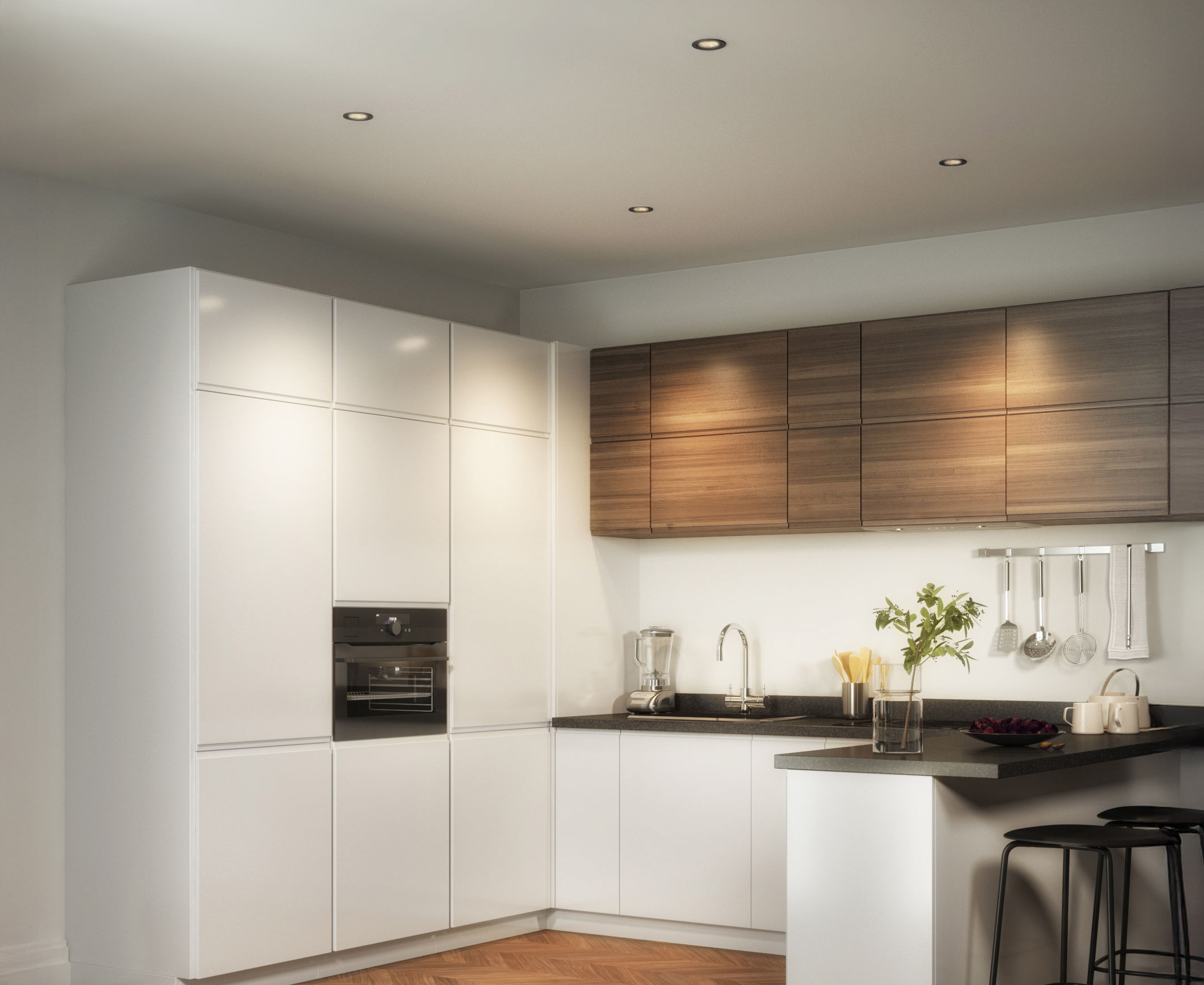 Runde LED Einbaustrahler in der Kuechendecke fuer helle Beleuchtung ueber Arbeitsflaeche